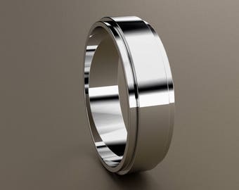 May include: A polished silver ring with a flat, wide band and a beveled edge. The ring reflects light, creating a bright, metallic appearance. The design is simple and modern, suitable for everyday wear.