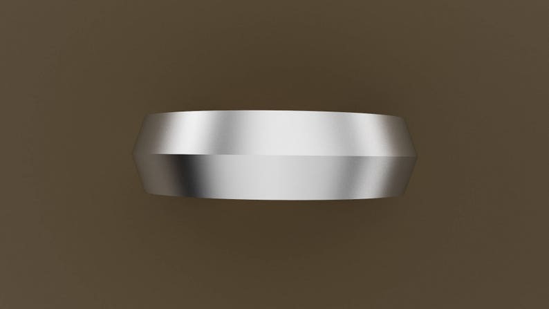 Peut inclure: Une bague en m&eacute;tal argent&eacute; avec un dessus arrondi l&eacute;g&egrave;rement bomb&eacute; et une finition lisse et polie.