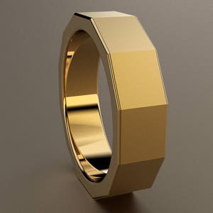May include: A gold octagonal ring with a smooth, polished finish.