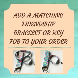 May include: Add a matching friendship bracelet or key fob to your order. Two images show a blue and pink patterned key fob with a matching bracelet. The key fob has a silver key ring.