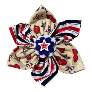 a red, white, and blue bow with a star on it