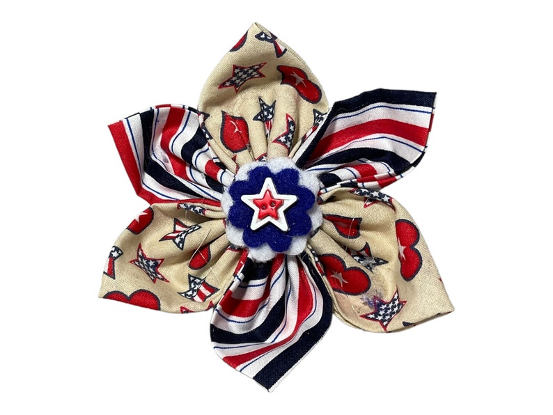 a red, white, and blue bow with a star on it