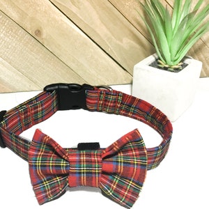 May include: Red and black plaid dog collar with a matching bow tie. The collar has a plastic buckle.