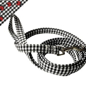 a black and white checkered leash with ladybugs on it