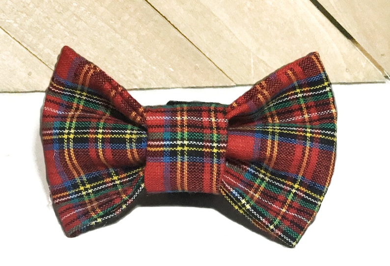 May include: Red, blue, yellow, and black plaid bow tie.