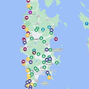 May include: A map of Phuket, Thailand, with various points of interest marked with icons. The map shows locations of hotels, restaurants, beaches, and other attractions. The map is overlaid on a satellite image of the island.