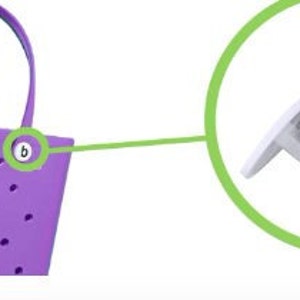 May include: Purple tote bag with a polka dot pattern and two white buttons labeled "b". The bag has two handles. A close-up of the buttons shows a white button with the letter "b" in black.