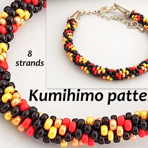May include: A close-up of a black, red and gold beaded bracelet made using the kumihimo braiding technique. The bracelet is made with 8 strands of beads and has a silver clasp.