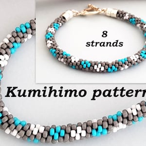 May include: A gray, white, and turquoise beaded bracelet made with the kumihimo technique. The bracelet is made with 8 strands of beads and has a silver clasp. The text "Kumihimo pattern" is written below the bracelet.