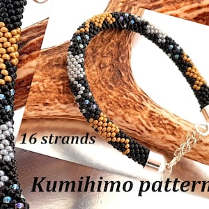 May include: A black, gold, and silver beaded bracelet with a silver clasp. The bracelet is made with 16 strands of beads and is a kumihimo pattern.