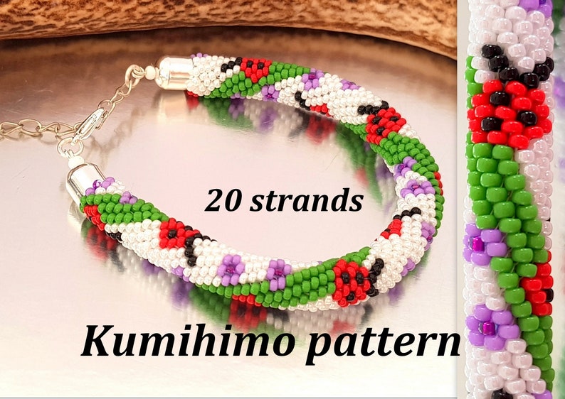 May include: A beaded Kumihimo bracelet with a silver clasp. The bracelet features a pattern of red, green, white, purple, and black beads. The text "20 strands" and "Kumihimo pattern" are visible.