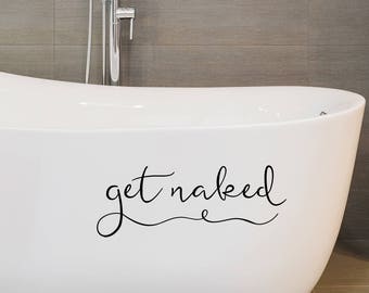 May include: White bathtub with the text "get naked" written in black cursive script on the side.