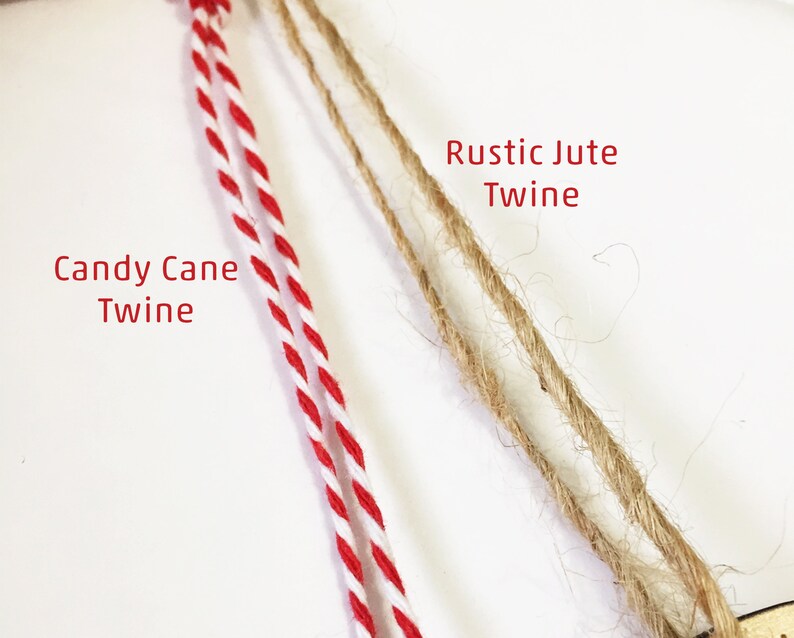 May include: Two types of twine, one red and white, labelled "Candy Cane Twine", and the other natural brown, labelled "Rustic Jute Twine".