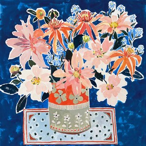 May include: A colourful painting of a floral arrangement in a decorative vase. The bouquet features large pink and orange flowers, with smaller blue and white blossoms. The vase is orange with green floral accents, set on a blue patterned surface against a deep blue background.