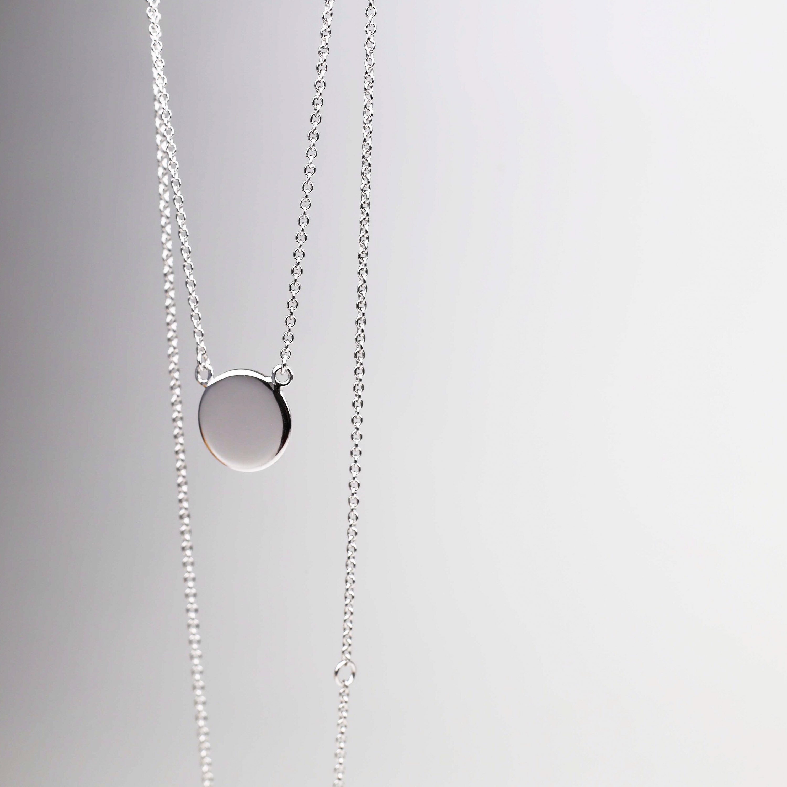 White gold disc pendant