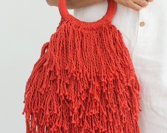 Bolso de mano avec flecos rojos