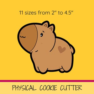 Peut inclure: Un emporte-pièce en forme de capybara brun de dessin animé avec un cœur sur le dos. L'emporte-pièce est disponible en 11 tailles de 2 pouces à 4,5 pouces.  PHYSICAL COOKIE CUTTER