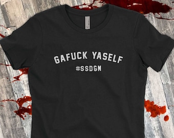 May include: Black t-shirt with white text that reads "GAFUCK YASELF #SSDGm".