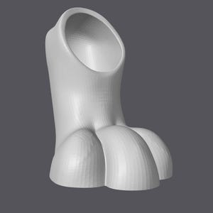 May include: A 3D-rendered, white, cat paw-shaped object. The object has a cylindrical body with a large opening at the top and three rounded toe-like structures at the base. The object is set against a grey background.