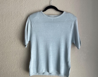 Vintage 1990’s baby blue real silk short sleeved light sweater with subtle indent pattern size medium by Jaclyn Smith