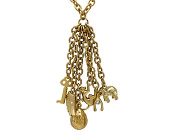 Collar largo llamativo con dije de borla en tono dorado de J.Crew, llave, elefante, mono, horquilla y diamantes de imitación, firmado por J.Crew.