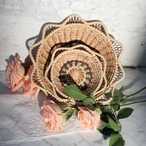 brown and green handwoven basket with delicate details
