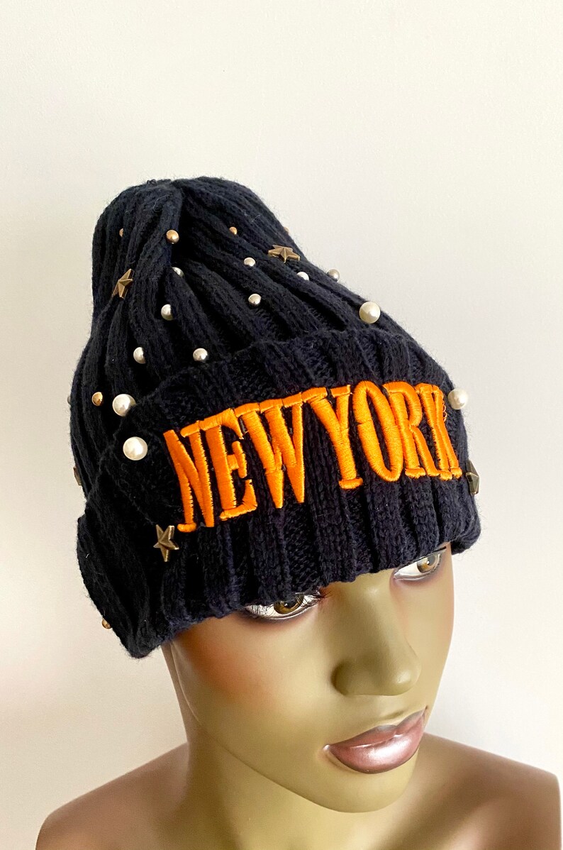 Navy blue knitted hat with orange lettering navy blue winter hat. women\u2019s hats navy blue knitted beanie