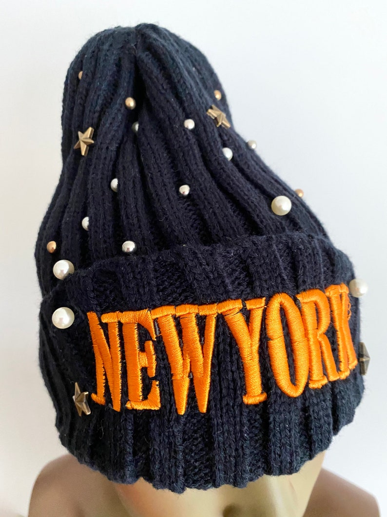 Navy blue knitted hat with orange lettering navy blue winter hat. women\u2019s hats navy blue knitted beanie
