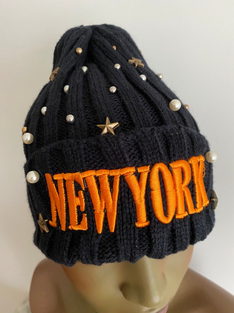 Navy blue knitted hat with orange lettering navy blue winter hat. women\u2019s hats navy blue knitted beanie