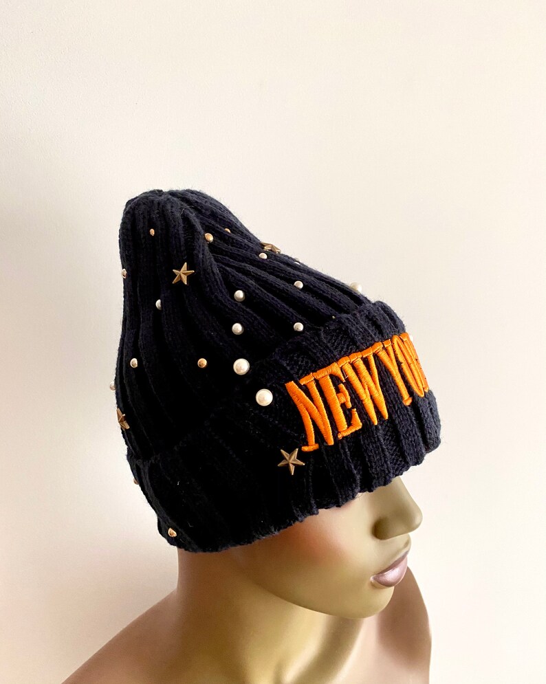 Navy blue knitted hat with orange lettering navy blue winter hat. women\u2019s hats navy blue knitted beanie