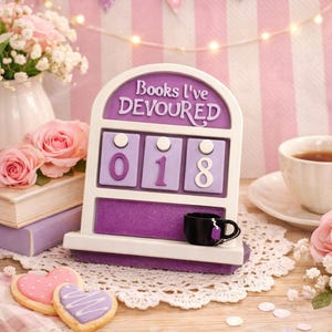 May include: A set of three ceramic mugs with a speckled, matte finish. The mugs are in shades of cream, light gray, and dark gray. Each mug has a simple, minimalist design, perfect for coffee or tea.