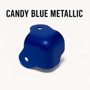 May include: A blue metal corner brace with rounded edges and a hole on each side.  CANDY BLUE METALLIC is written in black text at the top of the image.