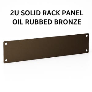 May include: A rectangular, oil-rubbed bronze 2U solid rack panel. The panel has four circular holes, two on each end. The text "2U SOLID RACK PANEL OIL RUBBED BRONZE" is printed in black at the top of the image.