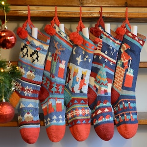 May include: Six colorful knitted Christmas stockings with different designs, including a snowman, a reindeer, and a Christmas tree. The stockings are hung on a wooden mantelpiece.