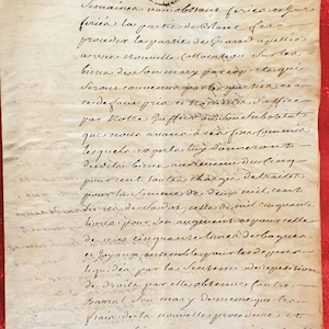 May include: Antique handwritten document on aged paper, featuring cursive script and a faded seal. The document, dated 09/08/1752, displays signs of age, including discoloration and wear, suggesting historical significance. The text is in French.