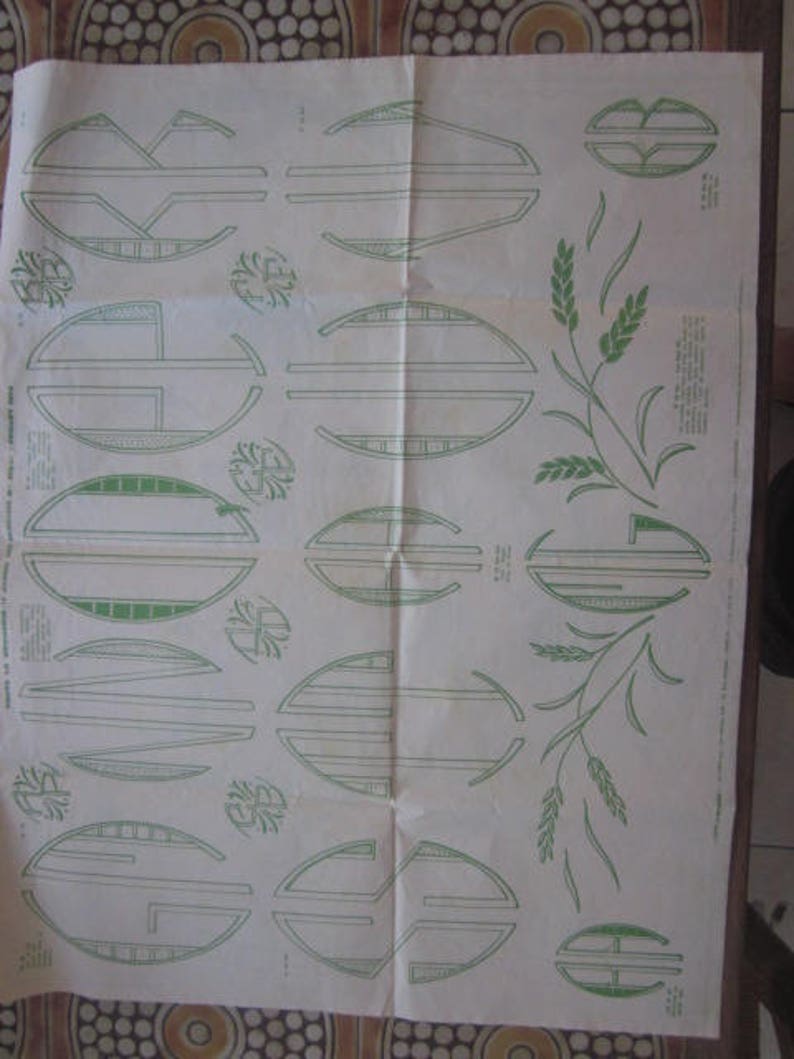May include: A black and white diagram with green lines showing different shapes and patterns. The diagram is on a white background and includes the text "Instructions for Embroidery Designs".