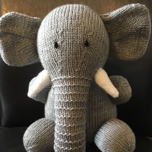 Handmade handknitted elephant toy.
