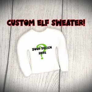 May include: White long-sleeved elf sweater with the text "YOUR DESIGN HERE" and a green question mark.
