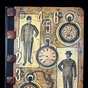 May include: A vintage-style journal with a collage design featuring pocket watches, numbers, and illustrations of men in suits. The cover has a textured, aged appearance with brown leather-like buttons along the spine.