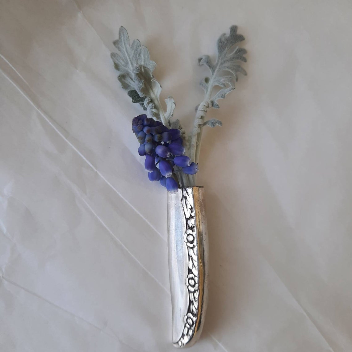Lapel vase. Made from an antique silverplate knife handle. Etsy