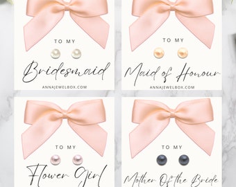 May include: Four cards with pearl stud earrings, each featuring a light pink bow. The cards are labeled "Bridesmaid", "Maid of Honour", "Flower Girl", and "Mother Of The Bride". The website address annajewelbox.com is printed on each card.