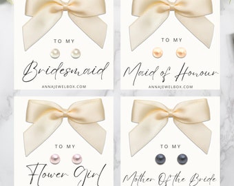 May include: Four cards with cream-colored bows and pearl earrings. Each card has text: "To My" and a title: "Bridesmaid", "Maid of Honour", "Flower Girl", and "Mother Of The Bride". The website address is "ANNAJEWELBOX.COM".