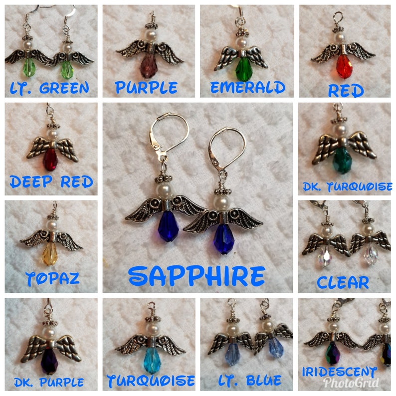 May include: A set of silver angel dangle earrings with a variety of colored crystal drops. The colors include light green, purple, emerald, red, deep red, dark turquoise, topaz, sapphire, clear, dark purple, turquoise, light blue, and iridescent.