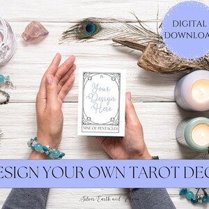 May include: A tarot card with a black and white illustration of a nine of pentacles. The card is on a white wooden surface with a hand holding it. The text on the card says "IX Your Design Here NINE OF PENTACLES". The image also includes candles, crystals, and peacock feathers.