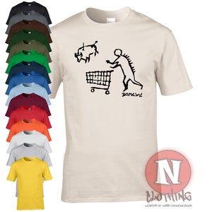 Banksy early man goes to market t-shirt. Another classic from the master of street art and urban artistic expression