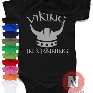 Viking in training baby suit vest.  Babygrow baby suit in sizes from 0-3 up to 12-18 months 10 colours. Raid with Ragnor!