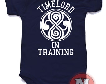 Timelord in training baby suit vest.  Babygrow baby suit in sizes from 0-3 up to 12-18 months and 8 colours. Whovian Dr Who fans