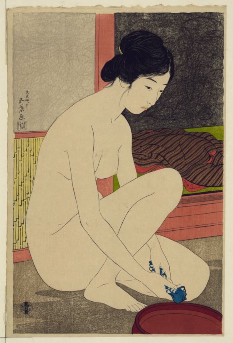 May include: A Japanese woodblock print depicting a person with dark hair styled in an updo, kneeling while washing with a blue cloth in a red basin. The scene includes a yellow bamboo-patterned screen, a dark textured area, and Japanese text.