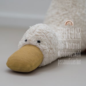 Music box duck organic plush natural white / linen ochre / melody selection