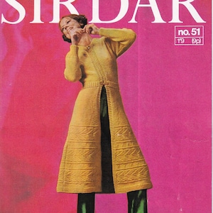 May include: A vintage knitting pattern booklet cover featuring a woman wearing a yellow knitted cardigan with a front opening and green pants. The cover is pink with the title "SIRDAR" and the text "no. 51 1'9 (9p)"